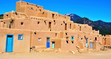 Taos Pueblo, by Elisa Rolle, image has been cropped and re-sized to fit our banner NM Archives logo